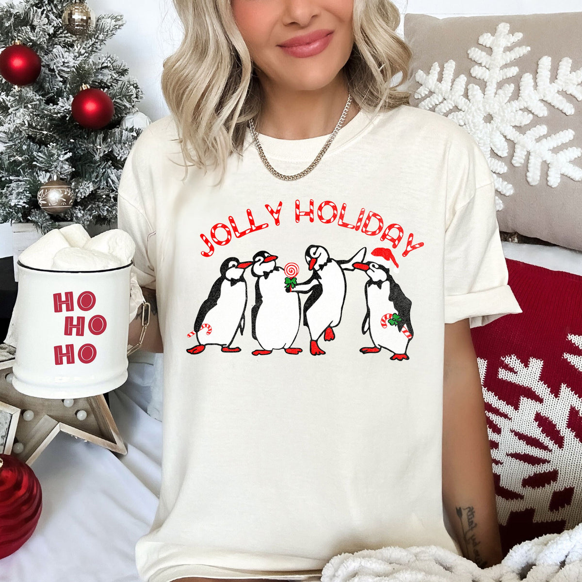 Jolly Holiday Penguins Christmas Parade In Cozy Winter Village Scene With Snowflakes And Cheer Comfort Colors Tee