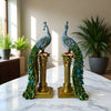 A pair of exquisite peacock ornaments standing on Roman columns add an artistic touch to the home.